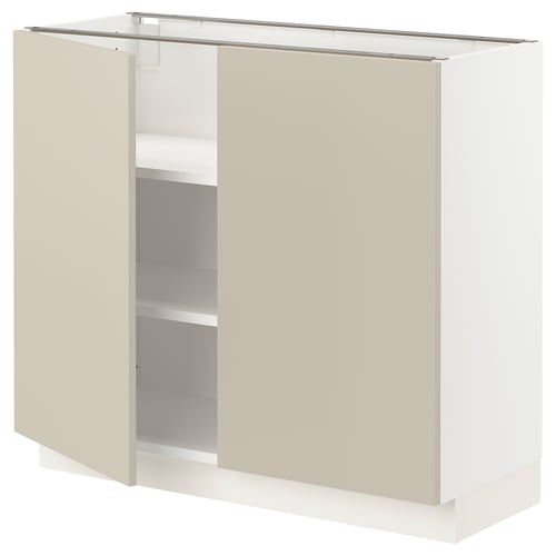 An open beige kitchen cabinet from IKEAs SEKTION series, featuring adjustable shelves.