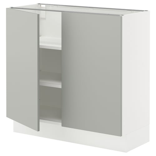 Modern white kitchen cabinet with light grey door and shelves.