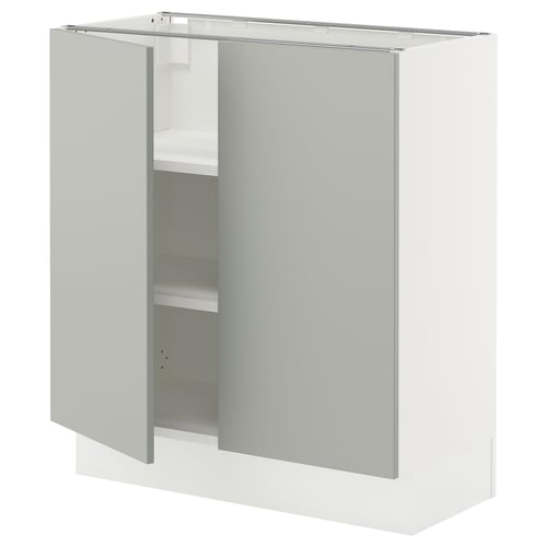 A white SEKTION kitchen cabinet with light grey doors and adjustable shelves.