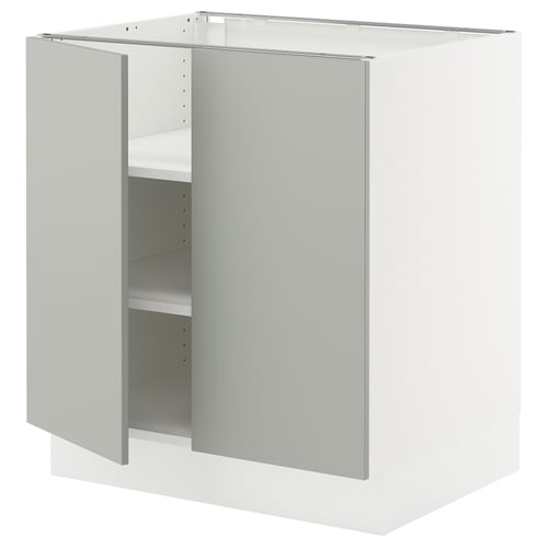 An open, modern white kitchen cabinet with a light grey door. It a square design and adjustable shelves.