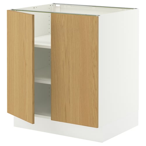 An ikea SEKTION white cabinet with wooden doors, featuring adjustable shelves and hinged doors with a damping mechanism for smooth closure.
