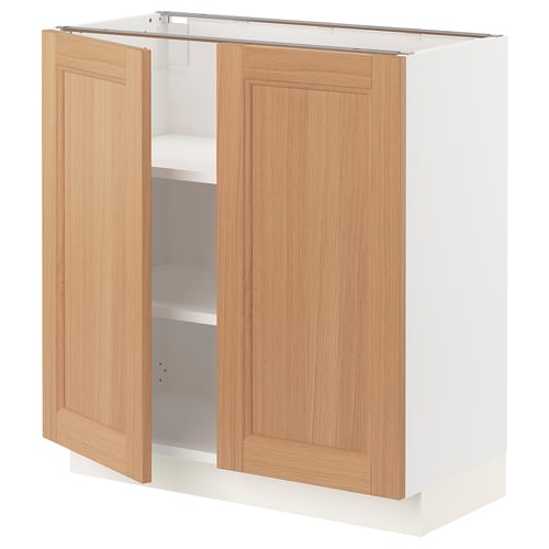 An open SEKTION kitchen cabinet with oak doors and white interior.