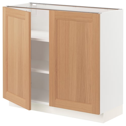 White kitchen cabinet, open, adjustable SEKTION shelves.