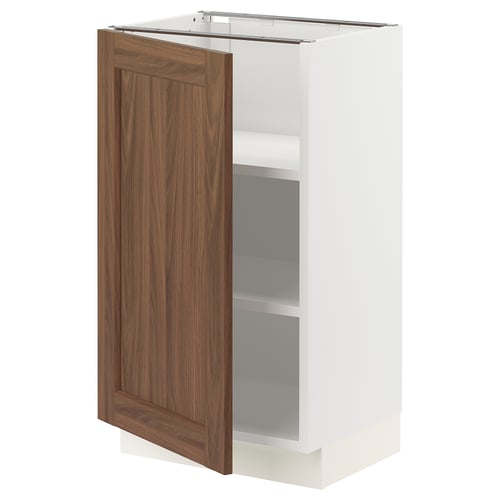 SEKTION kitchen cabinet in white and walnut. One door open, two shelves visible.