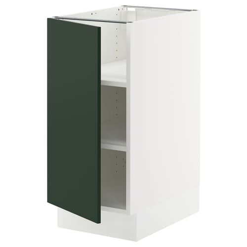 Displays an open white cabinet with a green door from the SEKTION kitchen system.