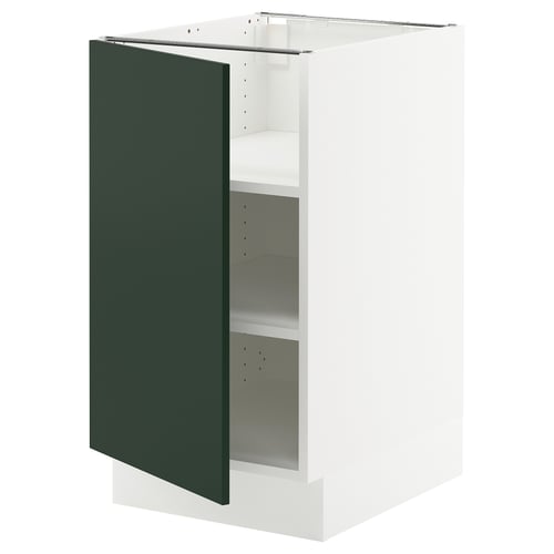 Modern white kitchen cabinet with dark green door and 2 shelves.