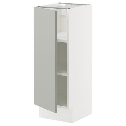 An open white SEKTION kitchen cabinet with light grey door, two shelves, and adjustable hinges.