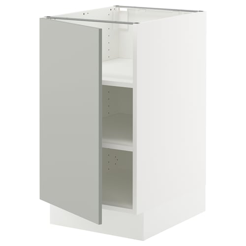 An open white ikea SEKTION kitchen cabinet, modern and minimalist in design, with a single shelf visible inside.