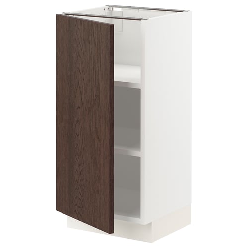 A white SEKTION kitchen cabinet with a dark brown wooden door and two shelves inside.