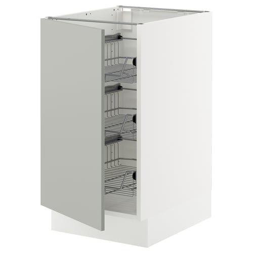 A white SEKTION kitchen cabinet with pull-out wire baskets for storage.