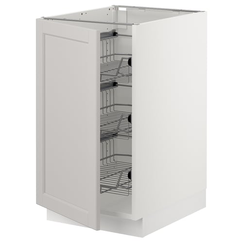 White ikea SEKTION kitchen cabinet with pull-out wire baskets for storing items.