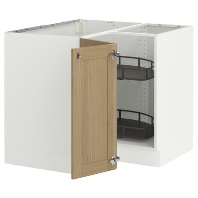 A modern kitchen cabinet setup. It an open white cabinet with a light oak door, holding black shelves.