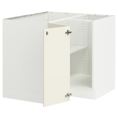 White SEKTION cabinets with shelves for kitchen storage.