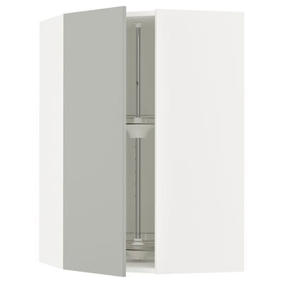 A SEKTION light grey kitchen cabinet with a carousel inside.