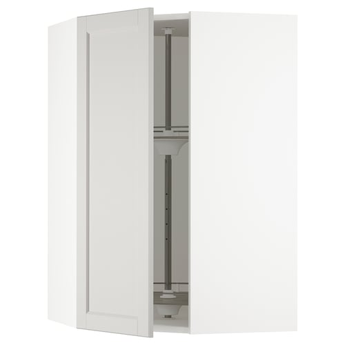 A SEKTION kitchen cabinet in light grey with two open doors, revealing swivel shelves inside.
