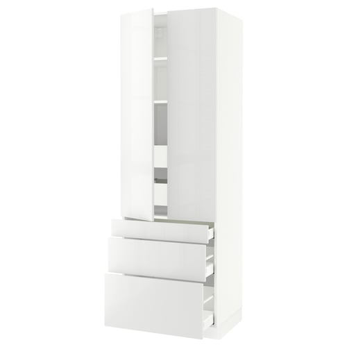 A white SEKTION tall kitchen unit with high-gloss drawers and cabinet doors. It a modern, sleek design with adjustable shelves.