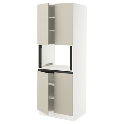 A SEKTION kitchen cabinet with beige havstorp fronts, featuring smooth surfaces and clean lines. It has two open doors revealing shelves.
