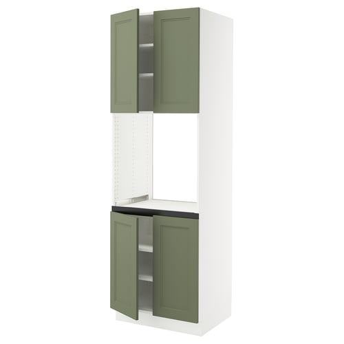 A tall green kitchen cabinet with two open doors, part of the SEKTION system. The cabinet is primarily white with green doors and shelves.