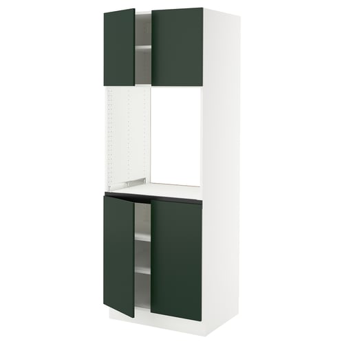 This image shows a white SEKTION kitchen cabinet with green doors. It two open green doors revealing shelves.