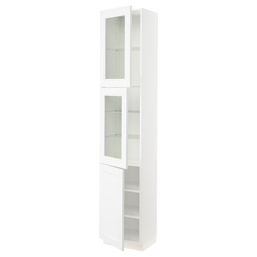 White SEKTION kitchen cabinet with glass doors and soft-close hinges.