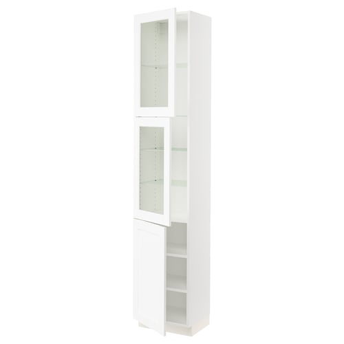 A white SEKTION kitchen cabinet with glass doors and adjustable shelves. It has a sleek, vertical design.