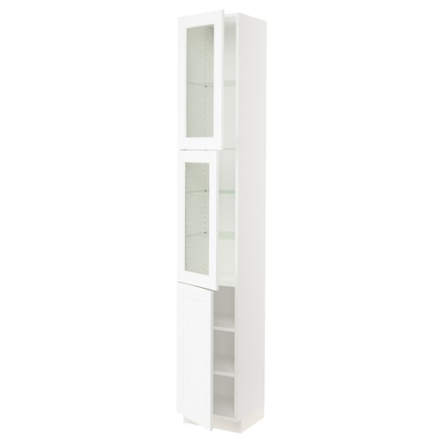 A SEKTION white cabinet with glass doors and adjustable shelves.