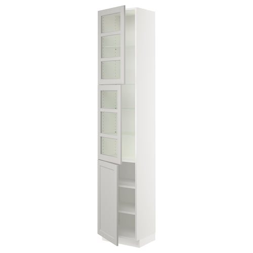 Depicts a white SEKTION tall kitchen cabinet with glass doors. It adjustable shelves and a traditional design.