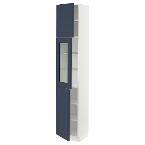 A tall white and blue kitchen cabinet with glass doors. The cabinet has adjustable shelves and blue doors with a modern design.