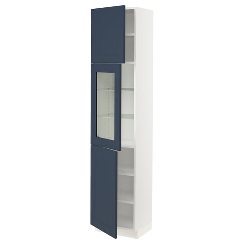Modern cabinet with blue glass doors and white frame. Tall, rectangular, holds multiple shelves.