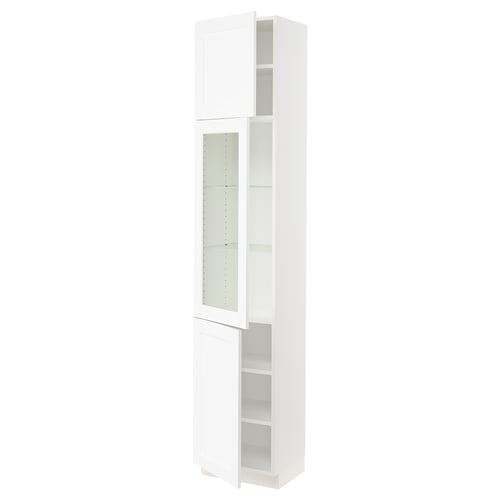 This image the SEKTION tall kitchen cabinet in white. It has glass doors with adjustable shelves and a sleek, modern design.