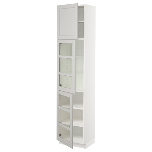 White SEKTION kitchen cabinet with glass doors and adjustable shelves.