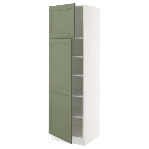 A tall, slim, white cabinet with greenish-gray doors, featuring a traditional panel design and an open door revealing adjustable shelves.