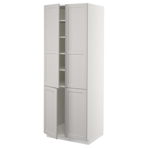 A white SEKTION kitchen cabinet with bevelled edges, featuring two doors and an adjustable shelf inside.