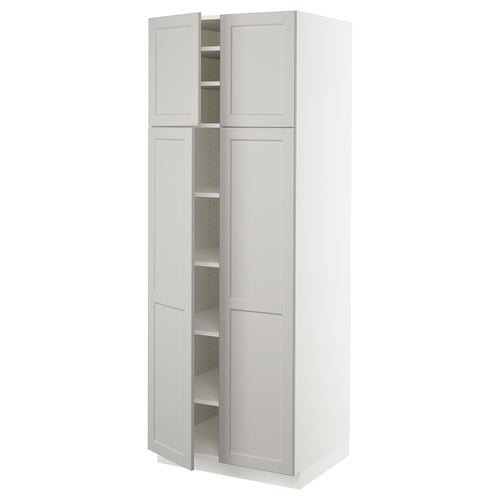 A white SEKTION kitchen cabinet with bevelled edges, featuring adjustable shelves and a door damper for slow closing.
