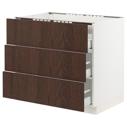 An ikea SEKTION kitchen cabinet with three dark brown wooden drawers on a white base.