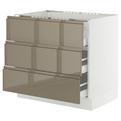 Modern kitchen cabinet with 3 gold drawers and sleek handles.