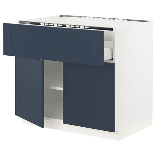 Modern kitchen unit with blue drawers and doors, white frame, adjustable shelves.