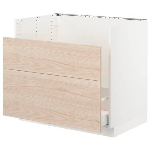 A white and light wood SEKTION kitchen cabinet with drawers and shelves, designed with a modern style.