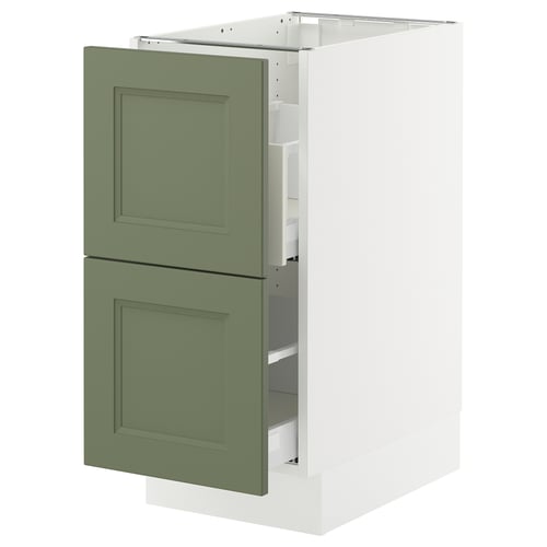 Green cabinet, part of IKEAs SEKTION kitchen system, with white frame and two square doors.