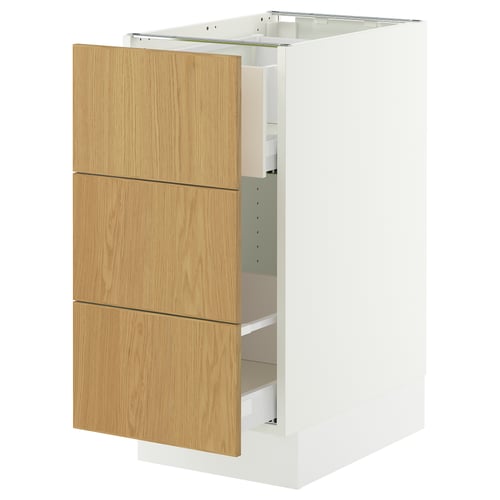A white SEKTION kitchen cabinet with light wood drawers. It three wooden drawers and is designed for kitchen storage.