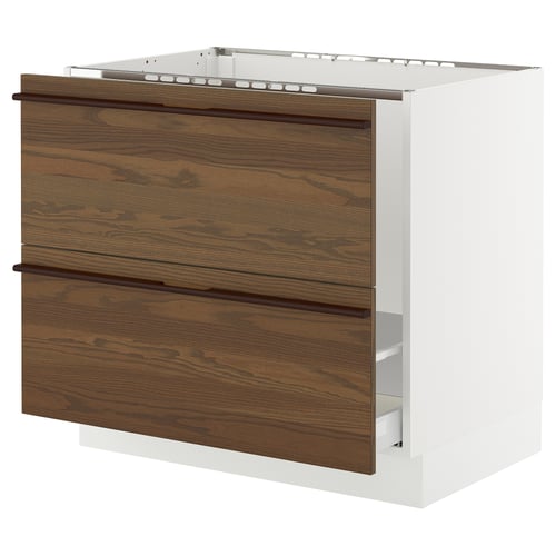 SEKTION kitchen cabinet in brown ash veneer with wooden handles, white base, four drawers.