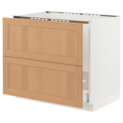 SEKTION kitchen cabinet with oak drawers and white base.