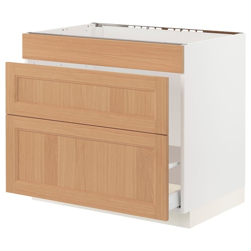 Displays a white and light oak kitchen cabinet unit with double drawers and a top rail.