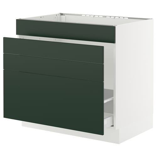 Modern green kitchen cabinet with three drawers and white frame.