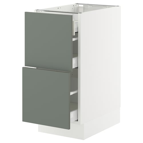 Modern kitchen cabinet with gray-green drawers and white base, sleek design.