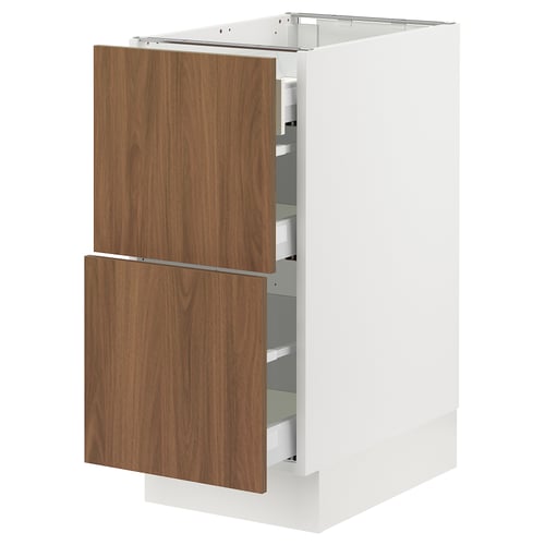 Modern white kitchen cabinet with walnut drawers; three drawers, sleek design.