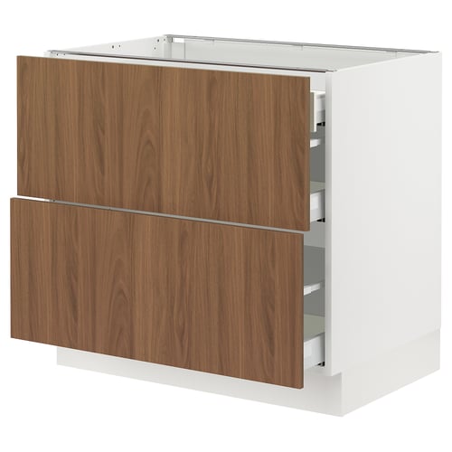 A modern white kitchen cabinet with walnut veneer doors and multiple drawers. The sleek design includes smooth-running drawers and a sturdy frame.