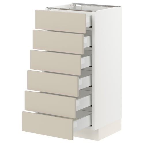 A white SEKTION kitchen cabinet with beige drawers. It has six drawers and a sleek, modern design, using materials like fiberboard and steel.