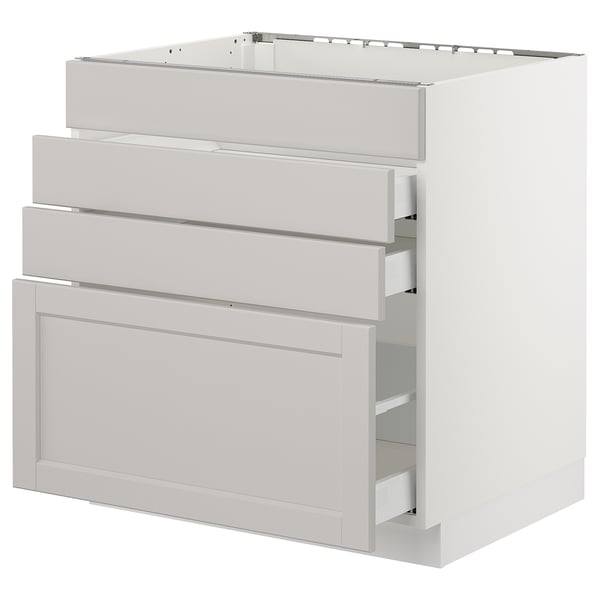 A white SEKTION kitchen cabinet with three drawers and one door, featuring a classic design with bevelled edges.