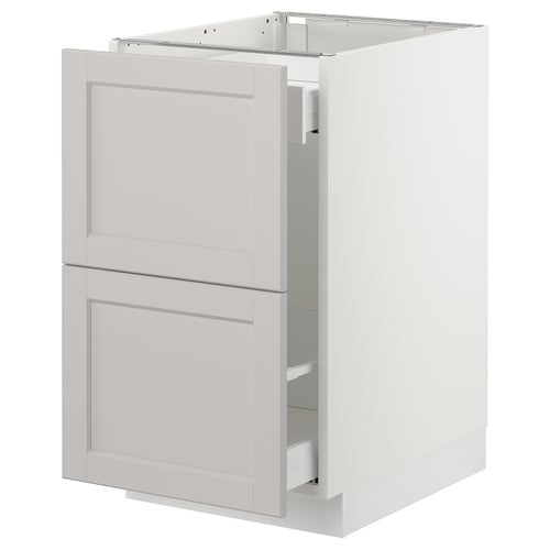 Displays a white SEKTION kitchen cabinet with a classic design, featuring two drawers and a door, made from birch and particleboard.